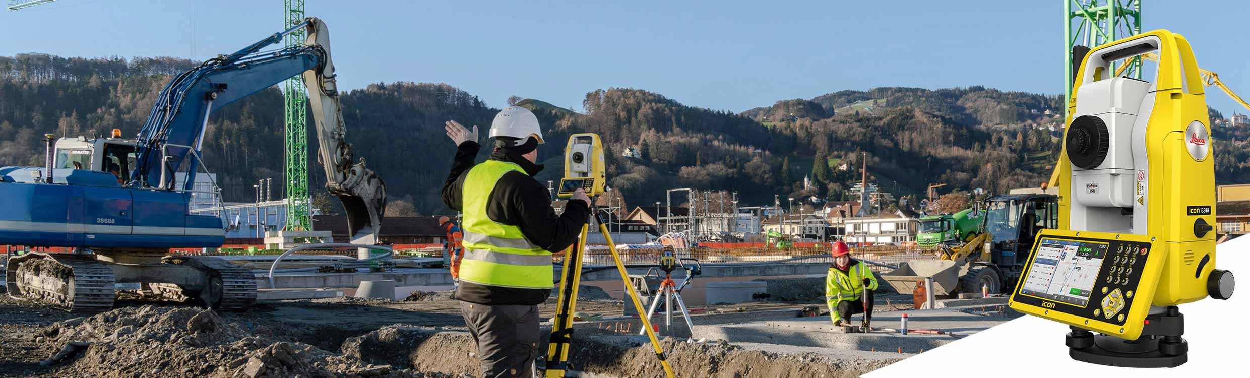 Construction worker with a Leica iCON iCB70 manual total station gives instructions to worker with construction mini prism pole to stake the correct point.